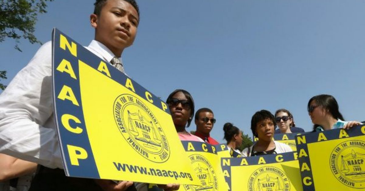 NAACP people w signs