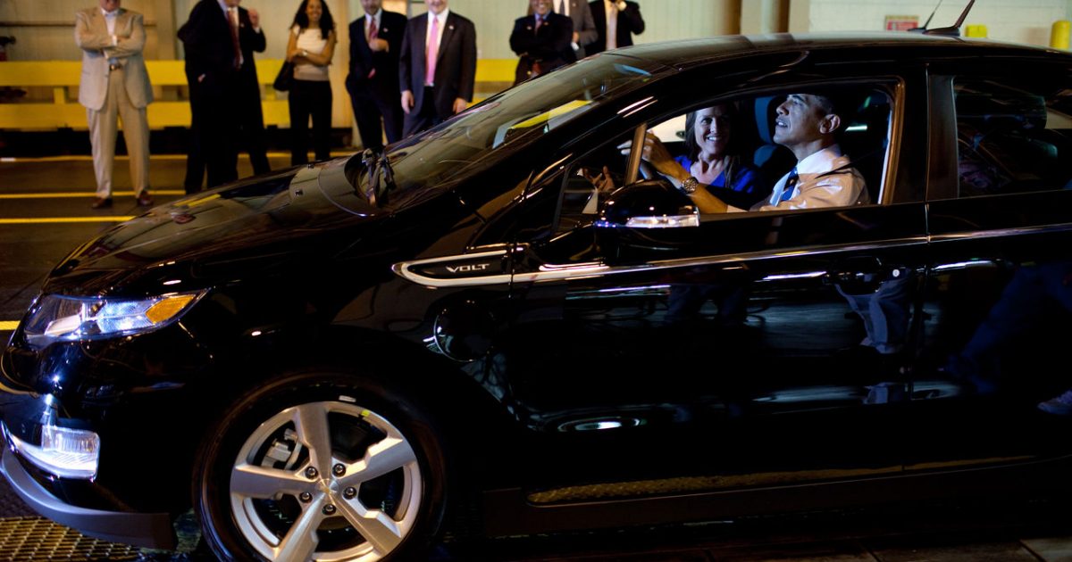 1280px-Barack_Obama_drives_Chevy_Volt